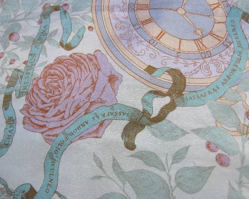 close up detail of de la Renta scarf, roses and clocks 
