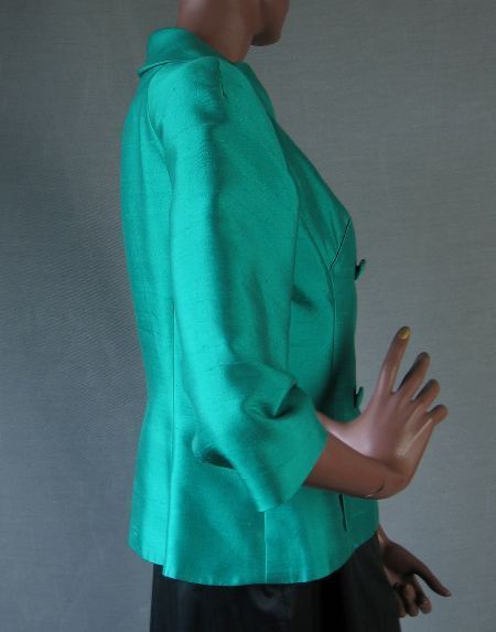 side view, green silk fit and flare 50s jacket