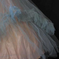 close up detail of 50s net prom dress ruffled skirt