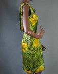 side view, fitted silk sheath dress in green and yellow floral print