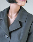 close up detail, notched collar lapels of 50s Chanel style suit jacket