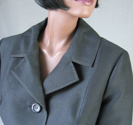 close up detail, notched collar lapels of 50s Chanel style suit jacket