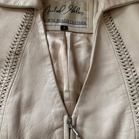 detail view of braided leather seaming, and label for North Beach Leather Micahel Hoban