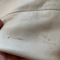 close up of small marks on leather jacket sleeve