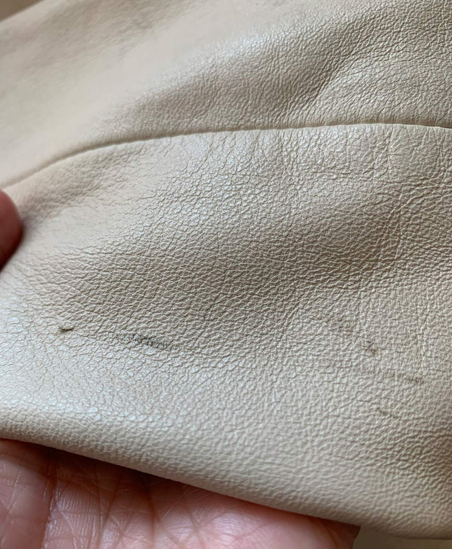 close up of small marks on leather jacket sleeve