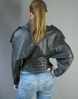 back view, 80s high style motorcycle jacket by Michael Hoban with batwing sleeves