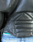 close up detail, back corset style waist of 80s designer motorcycle jacket