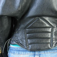 close up detail, back corset style waist of 80s designer motorcycle jacket