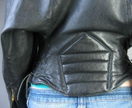 close up detail, back corset style waist of 80s designer motorcycle jacket