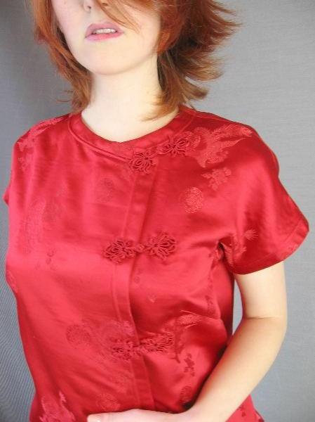 closeup of 60s red Asian top with ornate frog closures