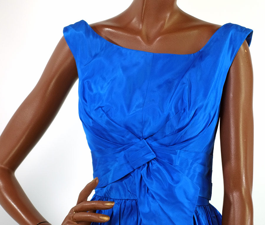 bodice of 50s taffeta cocktail dress showing intricate draping and folding detail at bust and waist