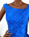 bodice of 50s taffeta cocktail dress showing intricate draping and folding detail at bust and waist