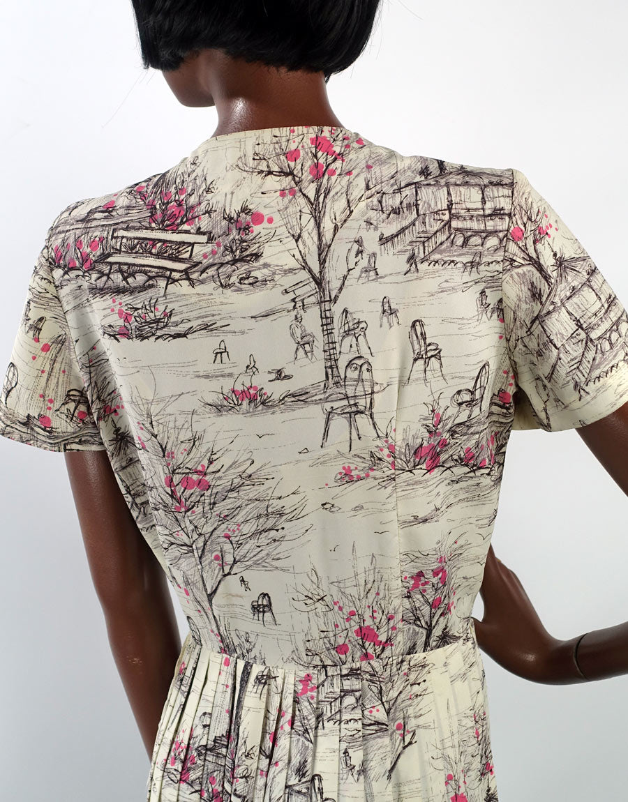 closer view, back bodice of novelty print dress depicting park bandshell, chairs and benches