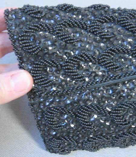 close up view, 960s black clutch fully covered in beads and sequins