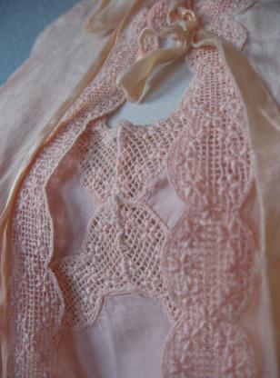 close up detail of scalloped net lace trim on nightgown and bedjacket