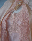 close up detail of scalloped net lace trim on nightgown and bedjacket