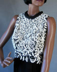bodice of Little Black Dress with lots of white beading and rhinestones