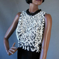 bodice of Little Black Dress with lots of white beading and rhinestones