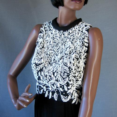 bodice of Little Black Dress with lots of white beading and rhinestones