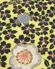 detail of floral print fabric with metallic embroidery enhancement