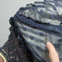 my finger pointing to small stain beneath netting of Edwardian bodice