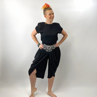 model demonstrating the wrapped harem style pantlegs