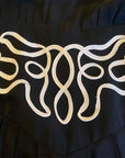 close up view of soutache braid swirling accent on wide waist