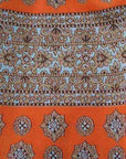 close up detail, orange white and brown paisley striped fabric