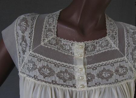 close up detail, net and lace bodice trim with pearl buttons, cream colored nylon nightgown