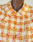 close up detail, orange and yellow plaid suit jacket with candy colored buttons