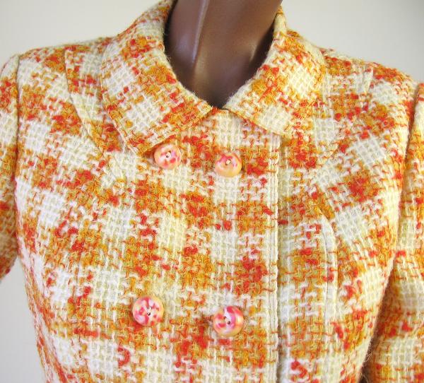 close up detail, orange and yellow plaid suit jacket with candy colored buttons