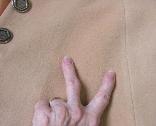 subtle uneven color on tan wool cape