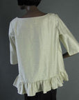 back view of trapeze shape ruffle edged blouse top