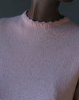 close up detail, decorative stitching on sweater neckline