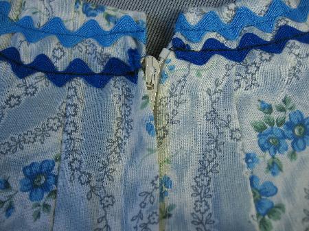 closeup detail floral blue and whie print with rick rack