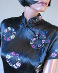 details, pastel floral Asian brocade against black satin Shaheen