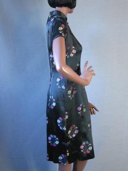 side view, black and pastel brocade Asian dress 