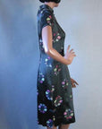 side view, black and pastel brocade Asian dress 