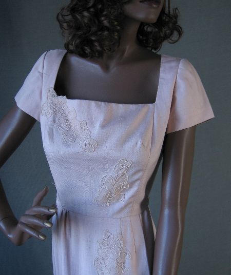 bodice of 1950s pink dress with lace appliques