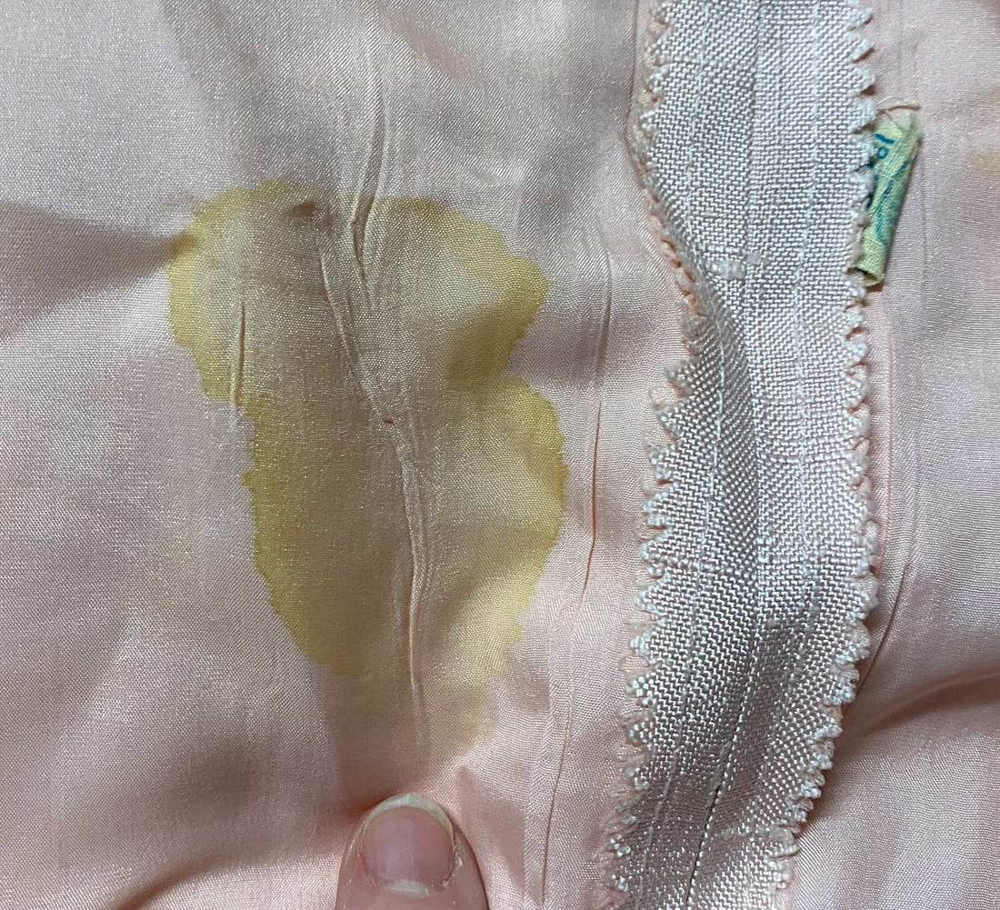 closeup of lining stain that does not go through to the dress fabric