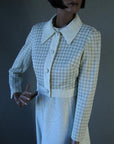 close up view 70s silver and white cropped houndstooth jacket with big collar