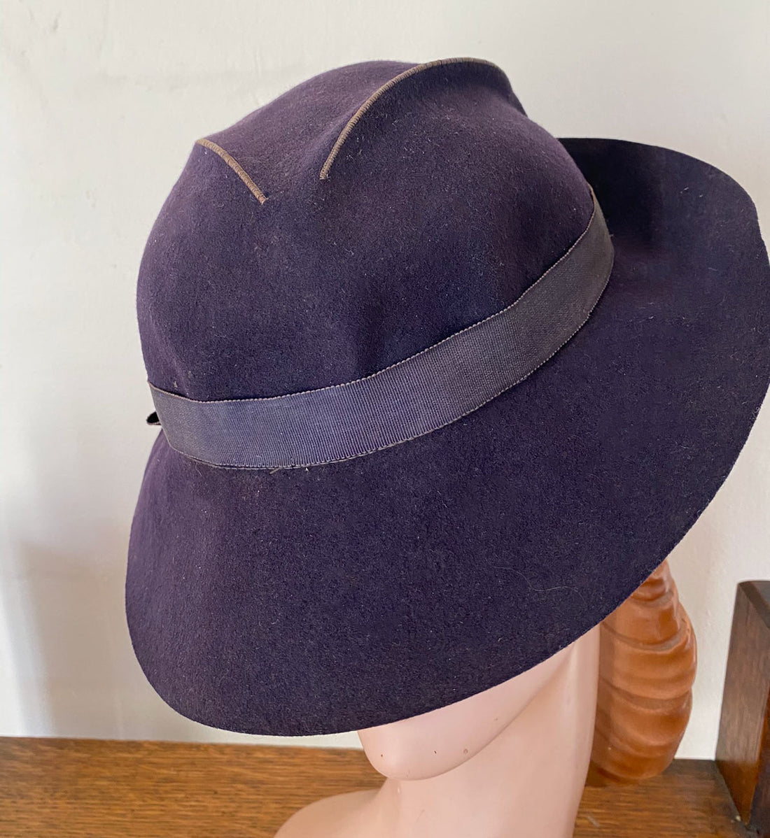 brimmed 30s hat showing low crown with slashed and stitched design element