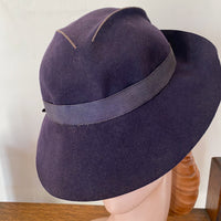 brimmed 30s hat showing low crown with slashed and stitched design element