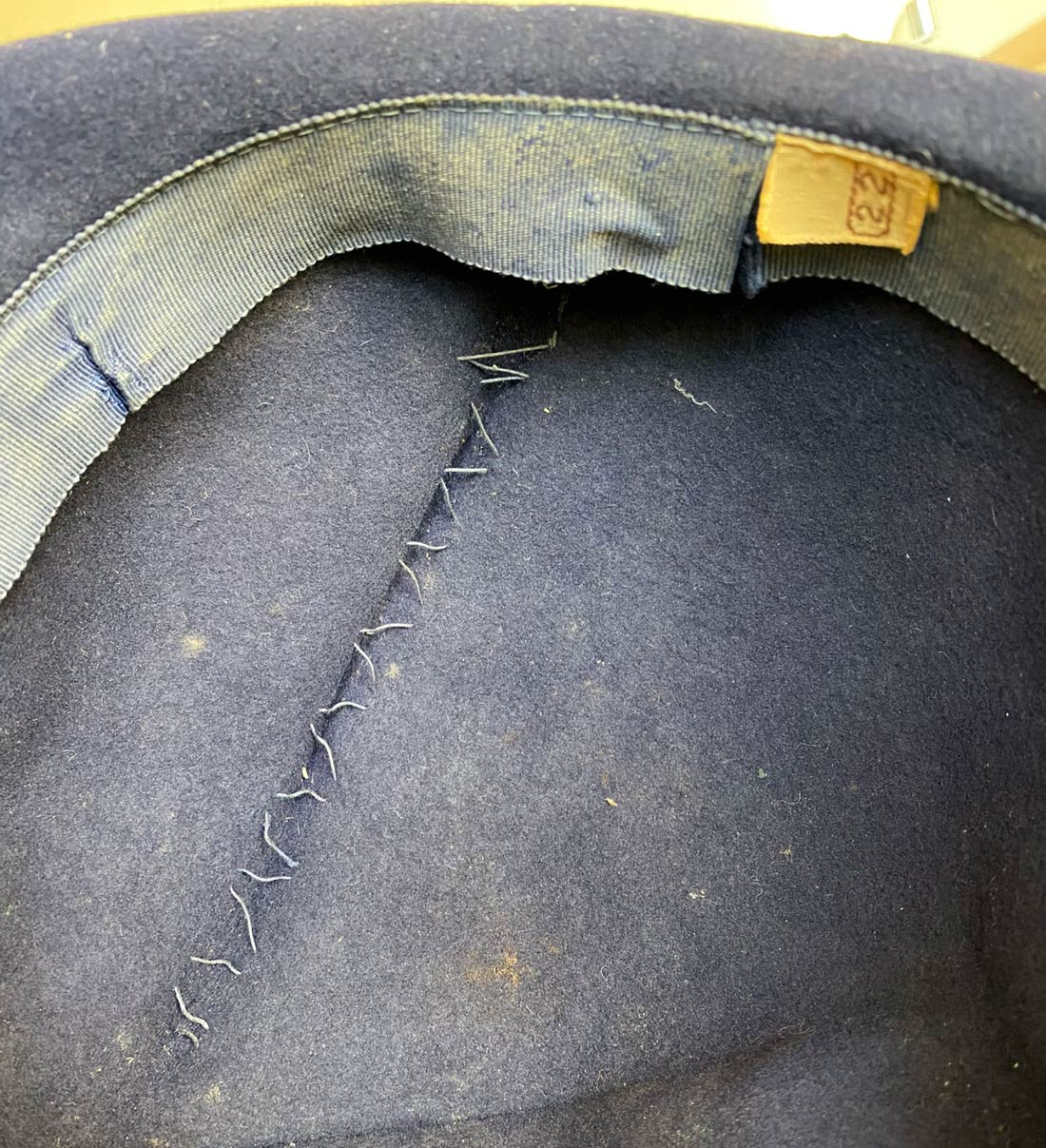 inside view of age related changes to hatband and closeup of shaping stitches