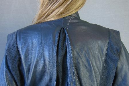 close up detail, suede trim panels and gusset of leather jacket