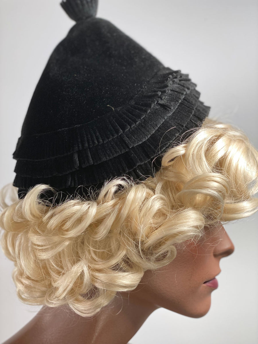 side view, peaked pixie women's hat with flat fringe