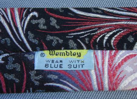 1950s vintage Wembley necktie label with close up of pink to black fade and pattern