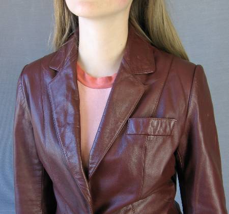 close up, lapels and upper body of curvy 70s leather blazer jacket