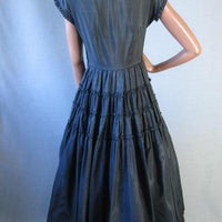 back view, 50s party dress with tiered full skirt