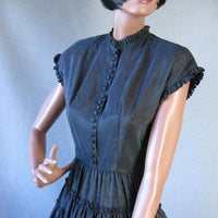 fitted bodice with ruffled cal sleeves and neckline, vintage 50s party dress